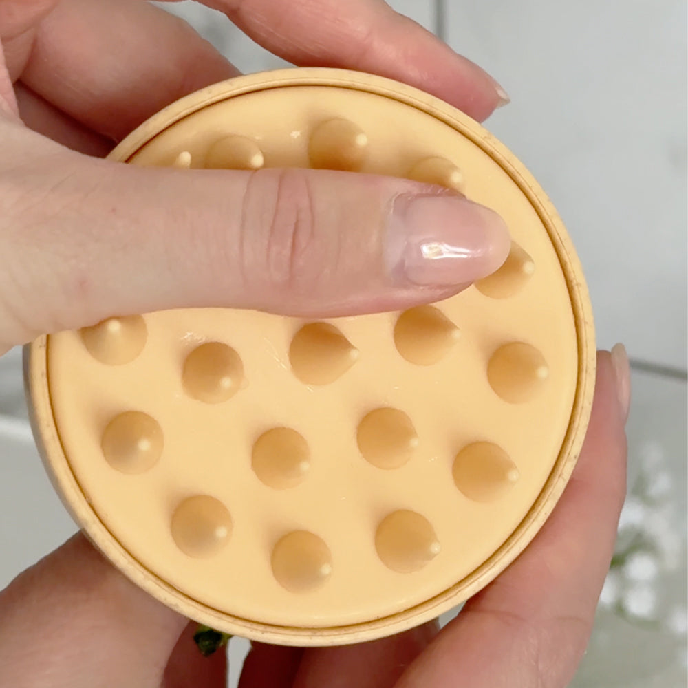 branded scalp massager displaying the silicon tips